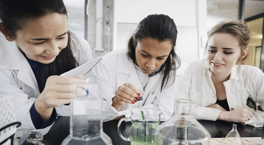 Three young researchers working at the STEM internships for high school students.