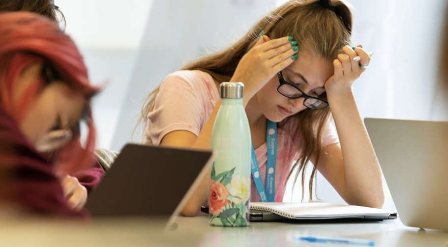 Students can be stressed while studying, highlighting the importance of mental wellness and academic support.